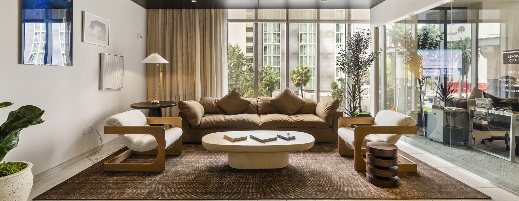 furniture and table in front of large windows
