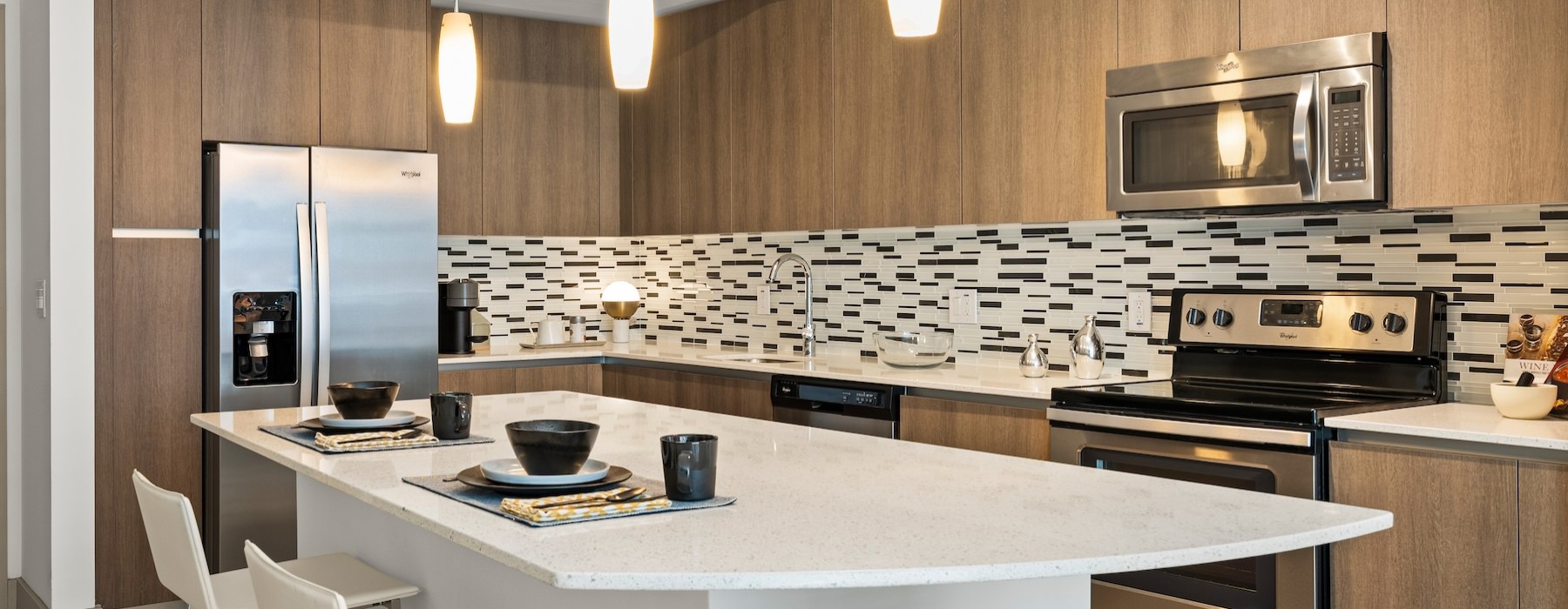 a kitchen with a table and chairs