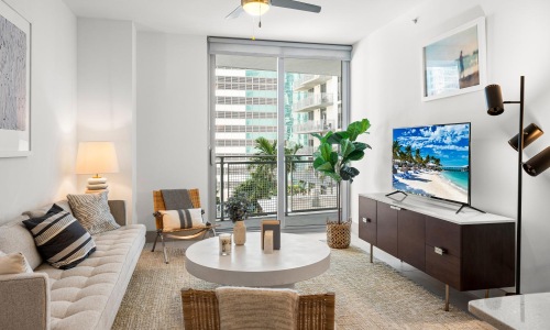 a living room with a tv and furniture